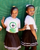 Two Wide Horizons students celebrating graduation together