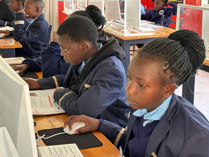 Students learning on computers