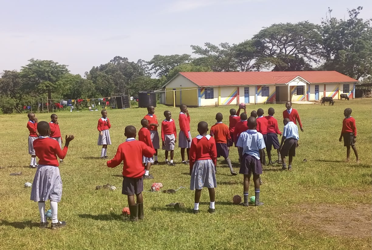 Petals of Africa students playing together on the school field