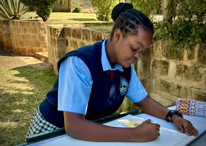 A Three Rivers student sketching outdoors on campus