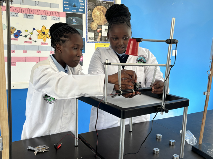 Students conducting a science experiment in the classroom